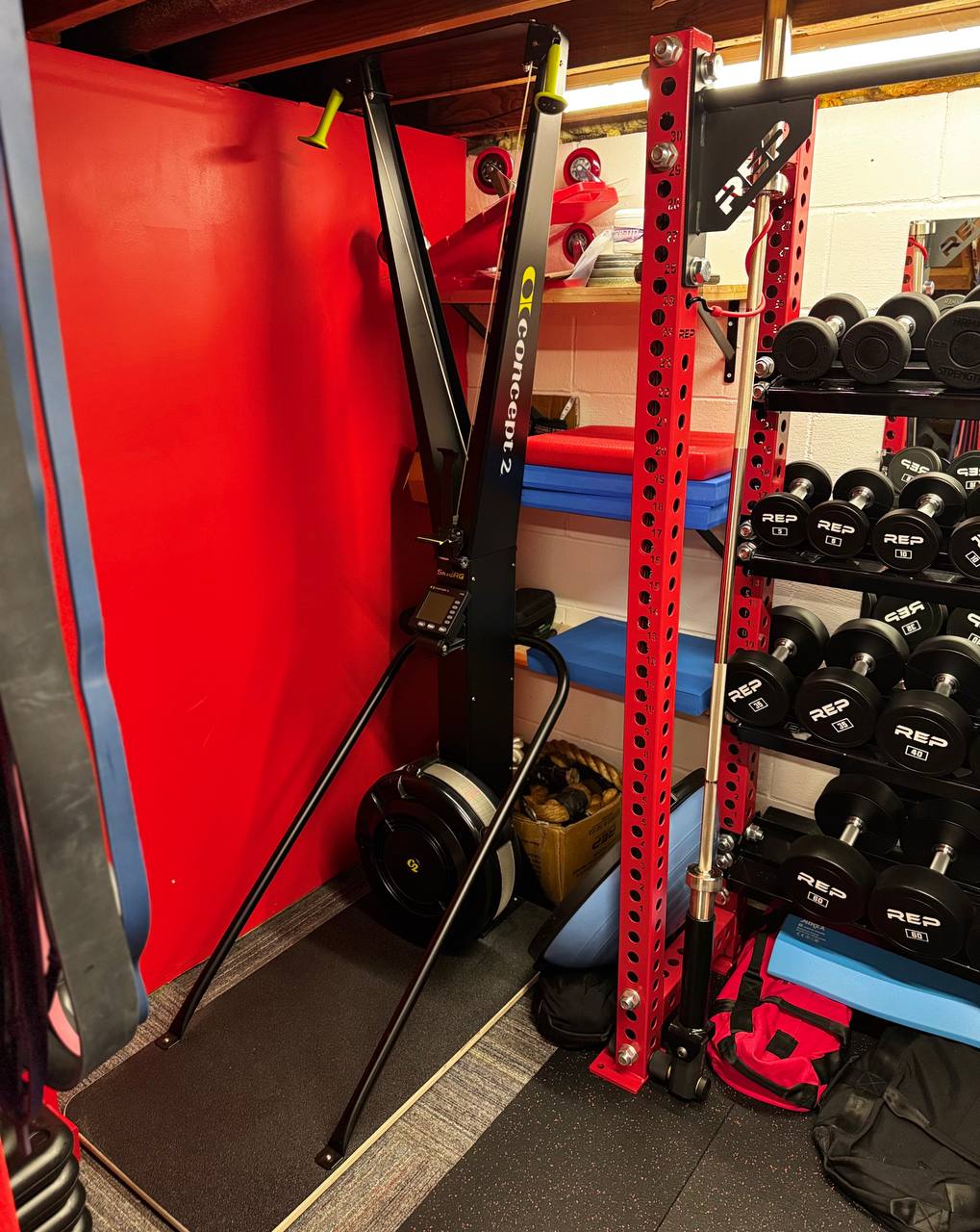 Conditioning equipment including Concept2 SkiErg and dumbbells in a private personal training gym in Coon Rapids
