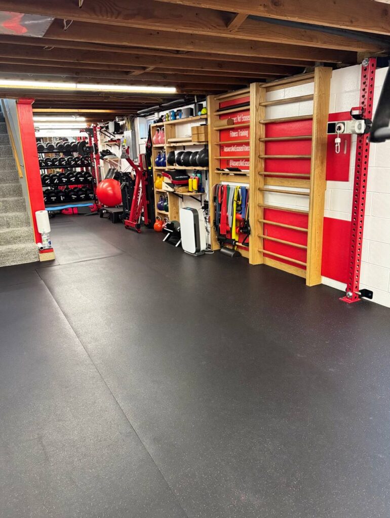 Functional training area with dumbbells and mobility equipment in a private Coon Rapids personal training gym