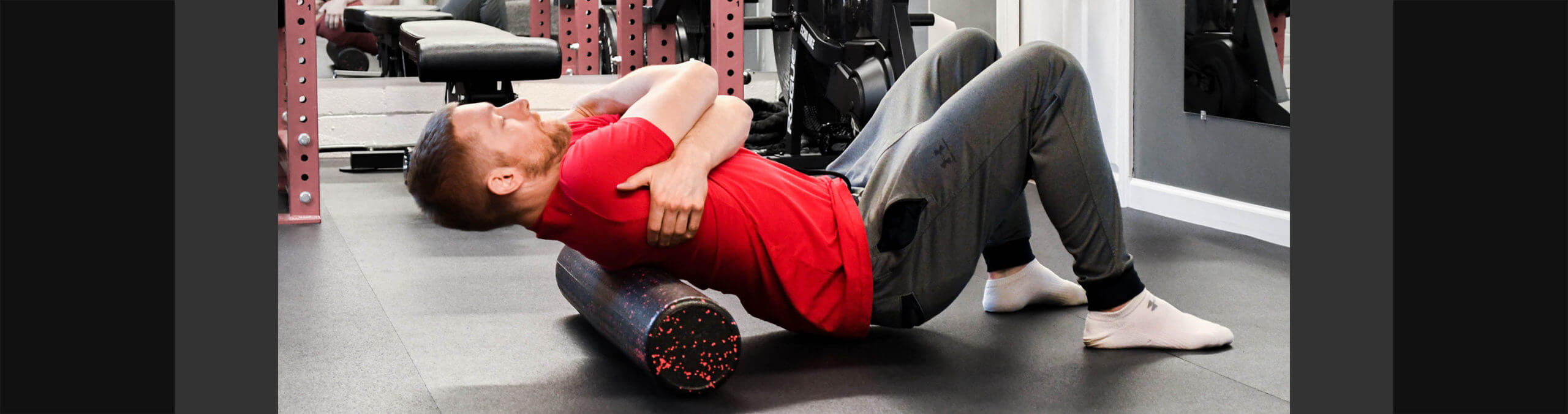 Personal trainer guiding recovery and mobility work during in person training in Coon Rapids Minnesota